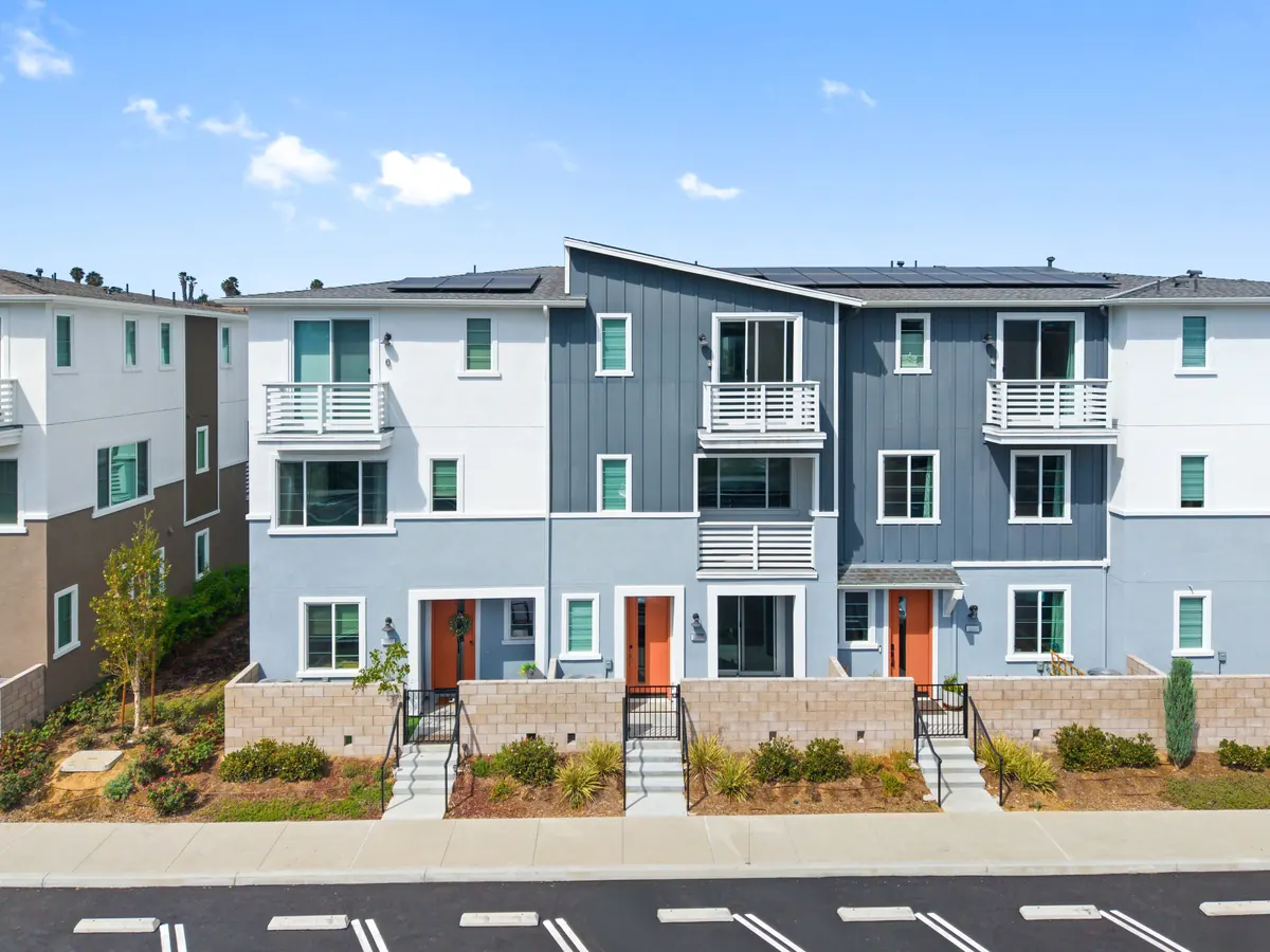 Three-story Cabrilla I townhomes with contrasting facades at Ponte Vista