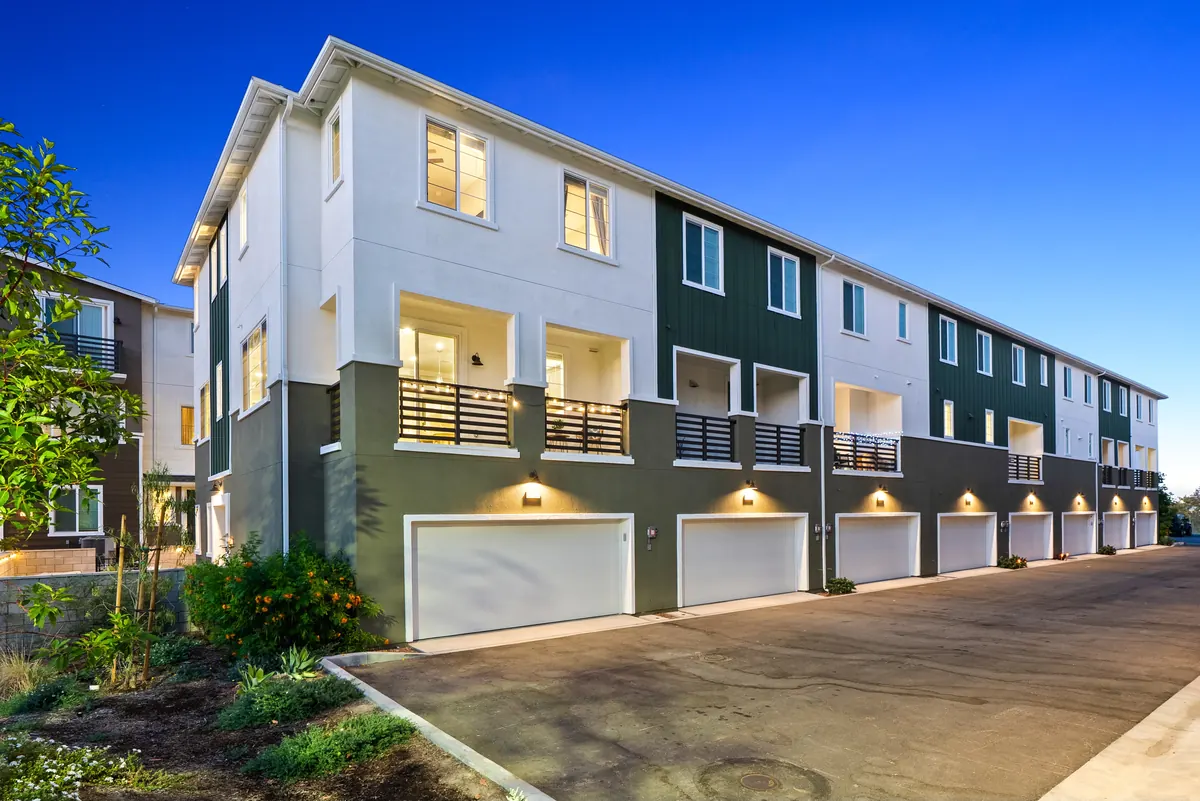 Twilight garage court behind a row of Cabrilla II homes at Ponte Vista