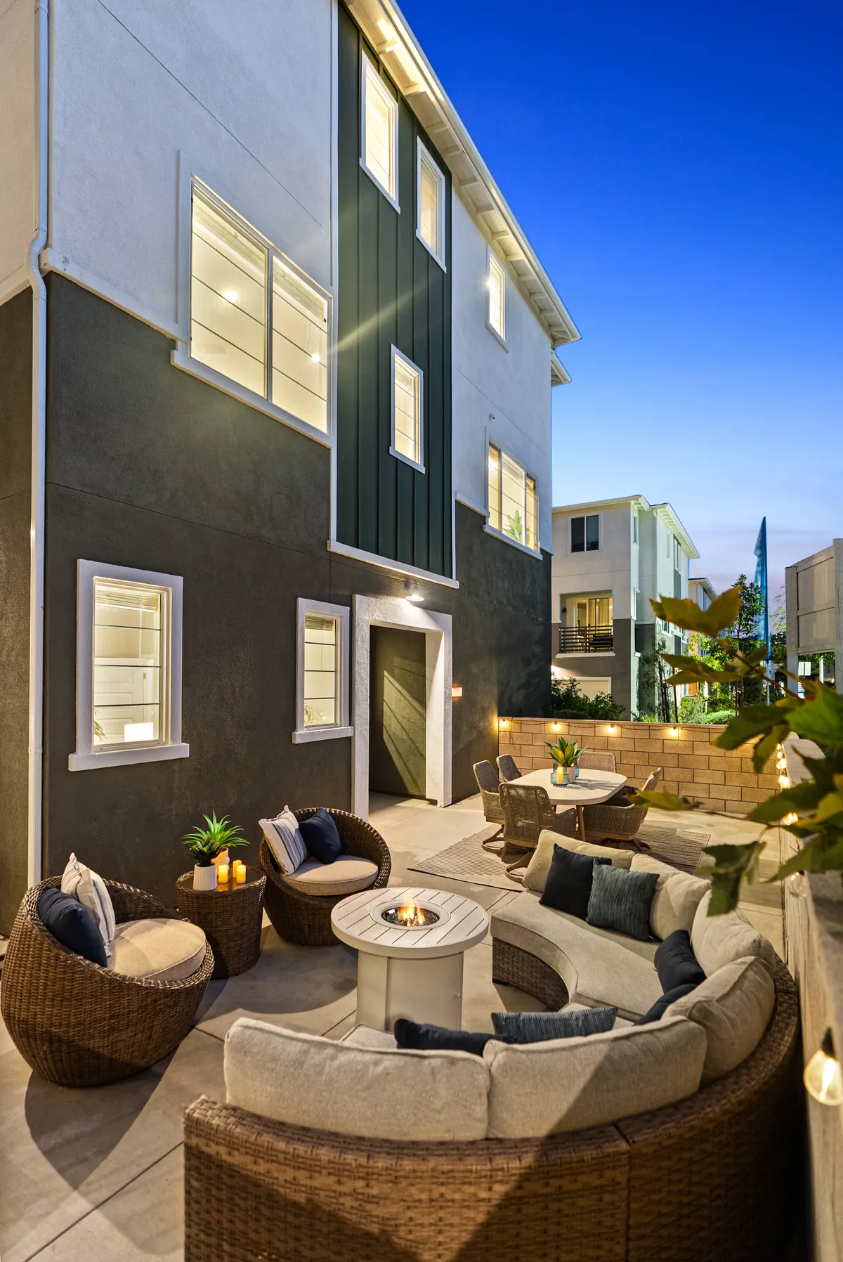 Private patio with lounge seating and a fire-pit table at a Cabrilla II home at Ponte Vista