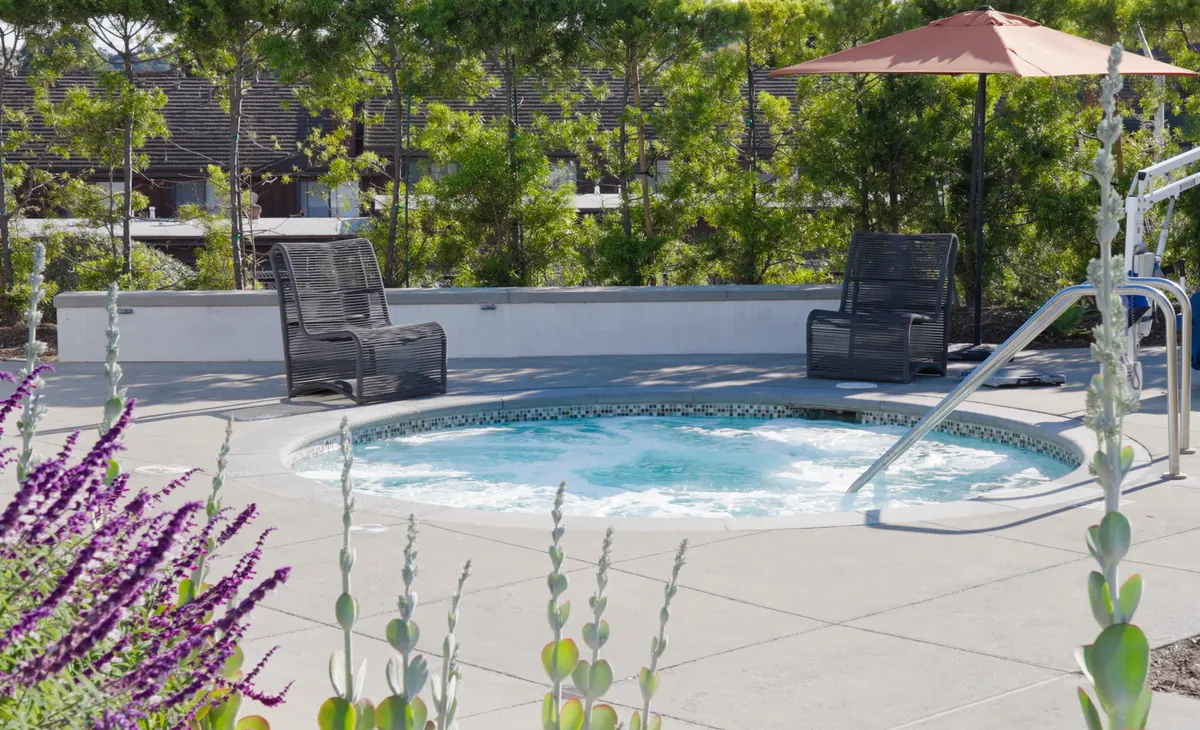 Lounge chairs beside the spa with lavender plantings at Ponte Vista in San Pedro