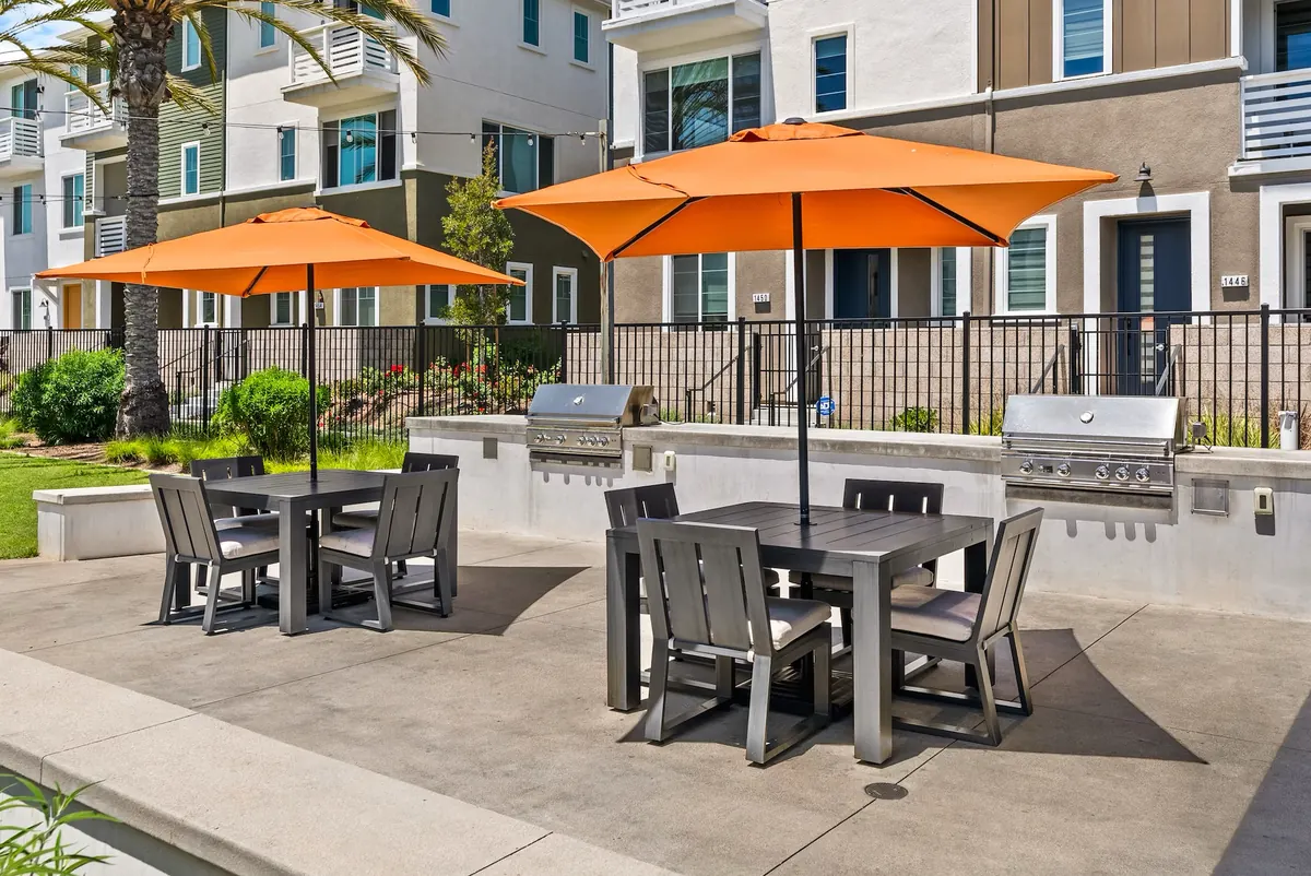 Outdoor barbecue grills and shaded dining tables at Ponte Vista in San Pedro