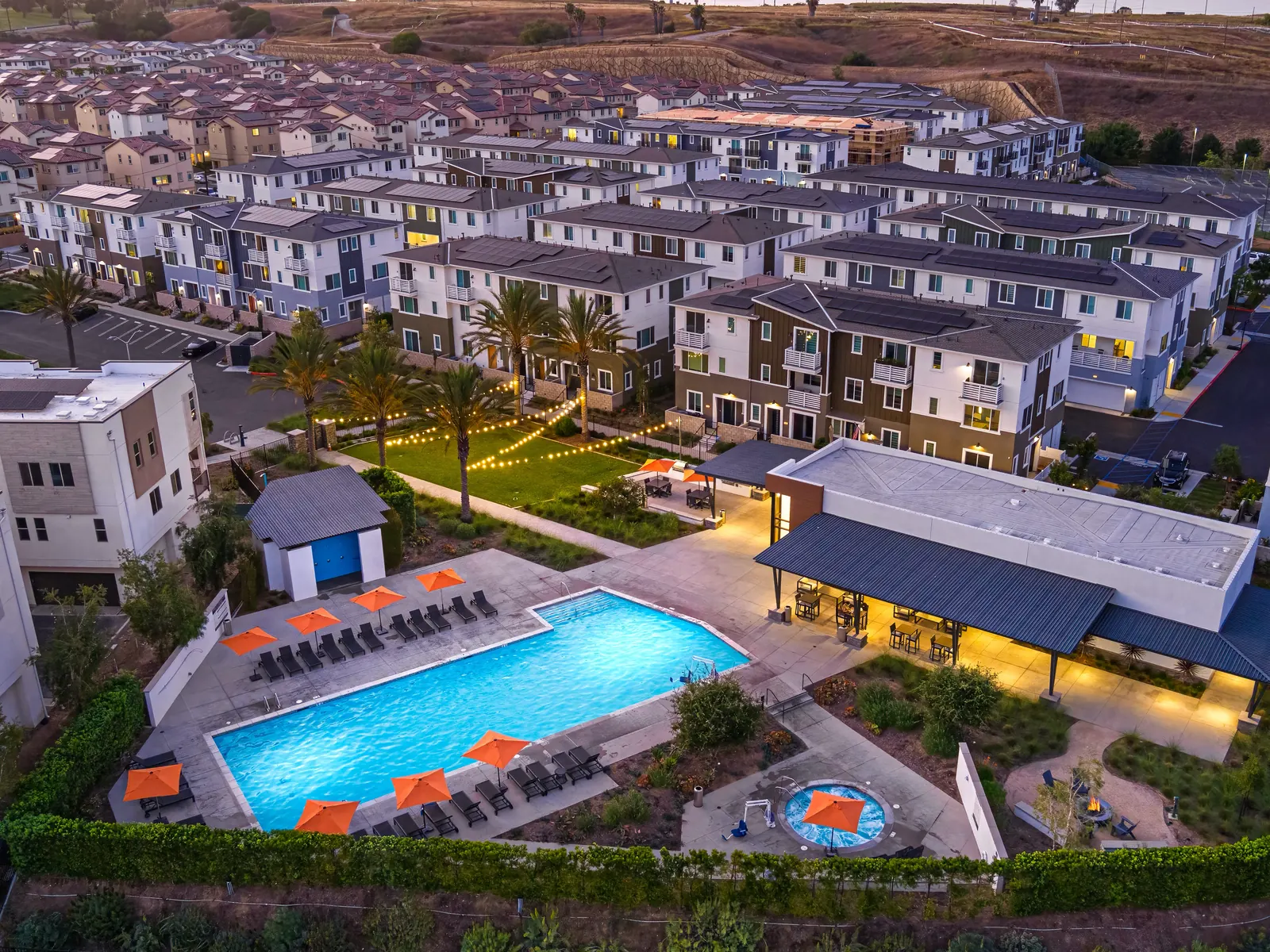 Twilight aerial of the Ponte Vista pool, clubhouse, and gathering areas