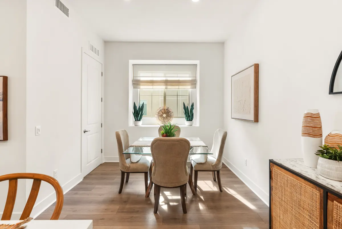 Dining room with a glass table in a Harbor Pointe home at Ponte Vista