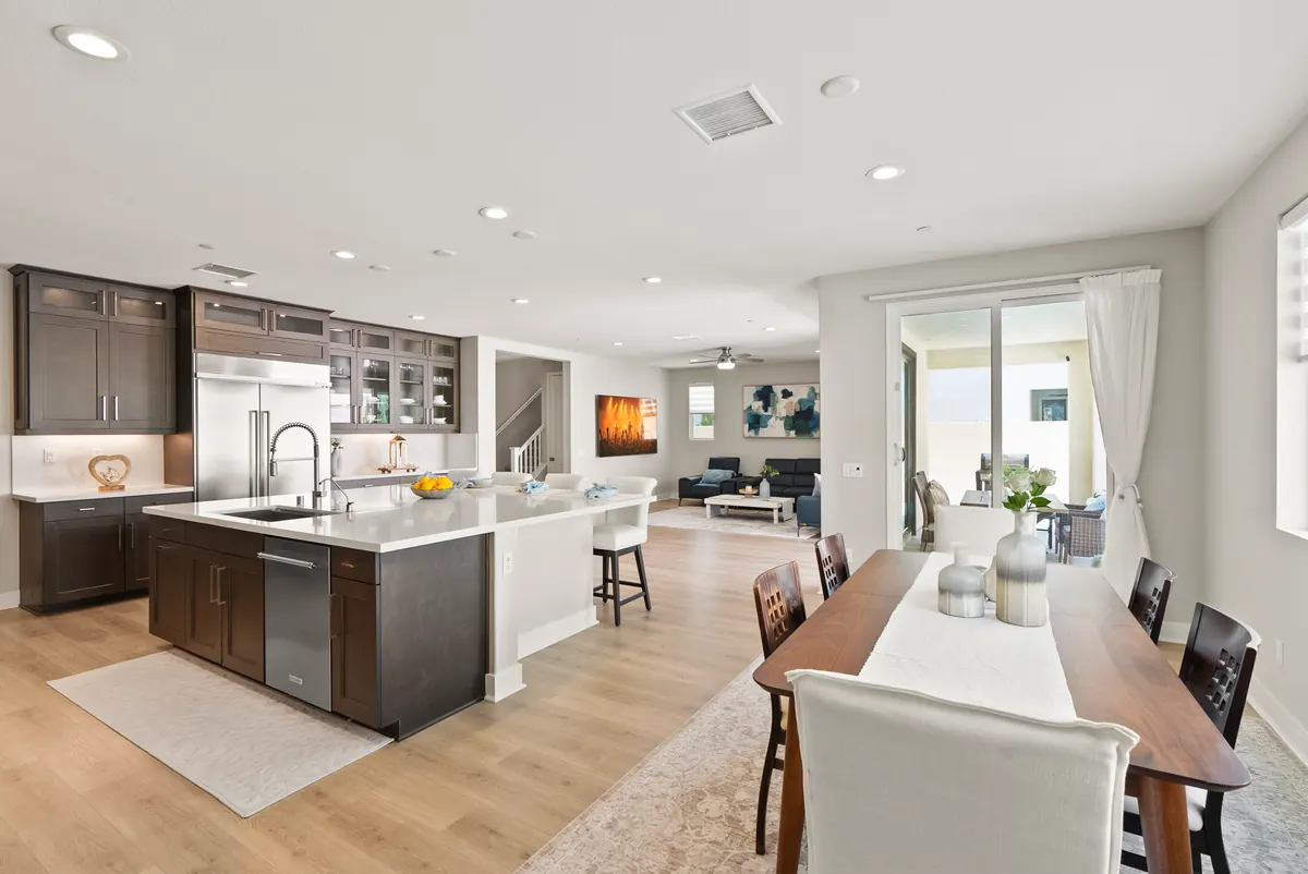 Kitchen with dark cabinetry and a large island in an Estates home at Ponte Vista