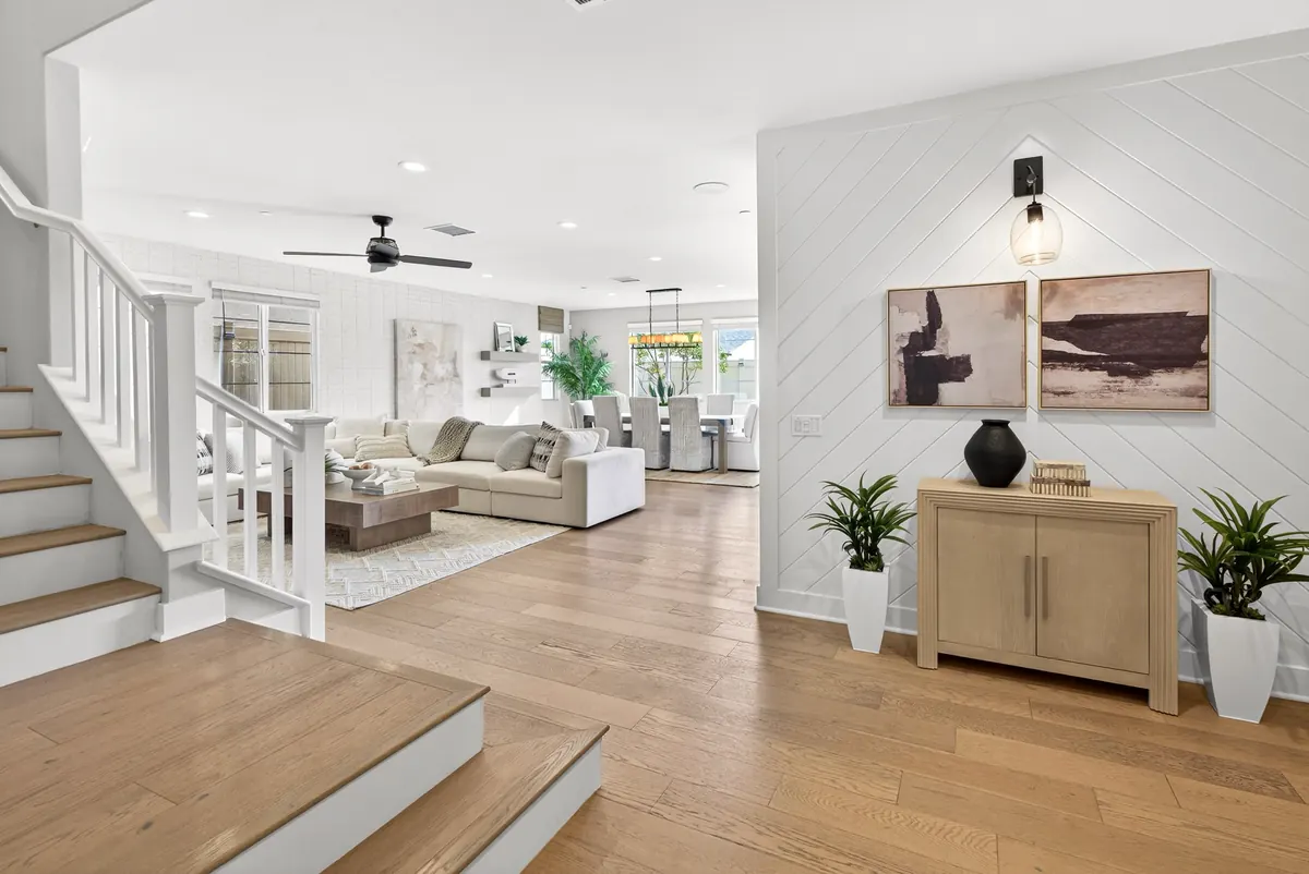 Living room and dining table in an Estates home at Ponte Vista