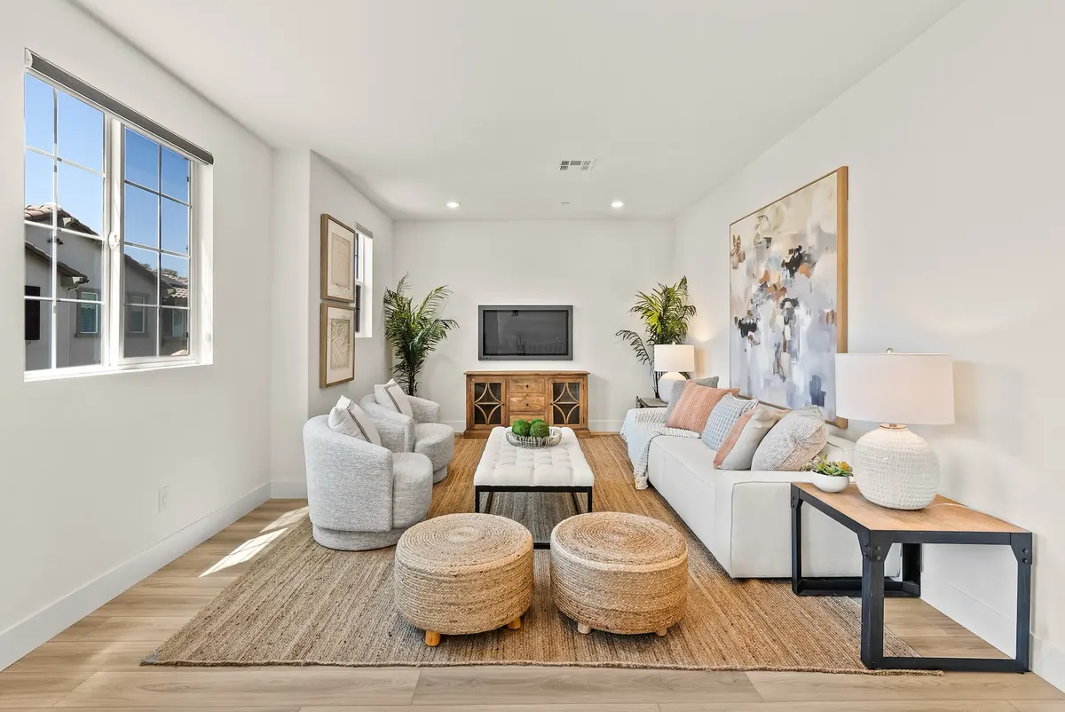 Living room with sectional seating in a Westport home at Ponte Vista